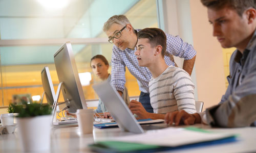 Students in apprenticeship attending computing class.